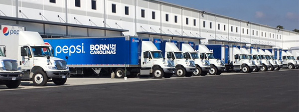 Delivery trucks staged at distribution facility in St. Pauls, North Carolina