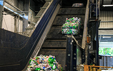 Recycling bales entering production process at Unifi warehouse. PBV partners with Unifi for the processing of recycling materials